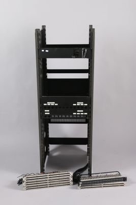 a close up of a rack with a bunch of wires on top of it