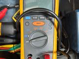 an image of a multimeter and other electrical equipment in a box