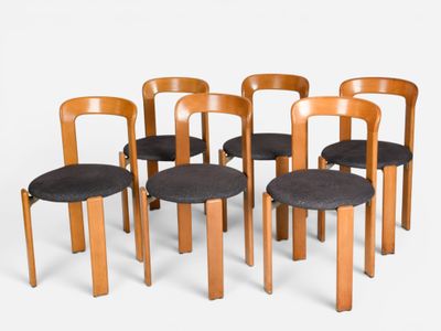 six chairs that are lined up in a row