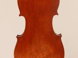 an old violin with a wooden back and bow on a white background