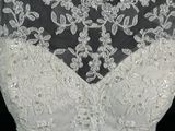 a close up of a wedding dress on a mannequin mannequin mannequin mannequin mannequin mannequin mannequin manne