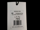 a white tag with a barcode on it on a black background