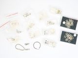 a lot of jewelry that is laying out on the table
