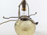 a glass lamp that is sitting on a table