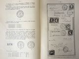 an open book with stamps on it and a page in the middle