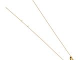 a gold necklace with a black butterfly on it