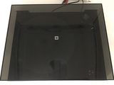 a picture of a glass box that has a black object in it
