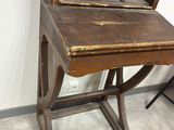 an old wooden desk with a mirror on it