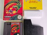 a box of nintendo games and a game card on a table