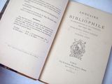 an open book with a picture of a coat of arms on it