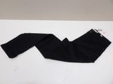 black pants on a white table with a tag on it