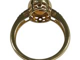 an image of a gold ring with a skull on it