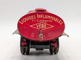 a small toy truck with a red sign on it