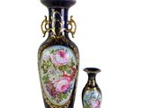 two vases sitting next to each other on a white surface