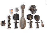 an image of a collection of african artifacts on a white surface