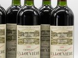 six bottles of red wine lined up in a row on a white surface