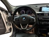 the interior of a car with a steering wheel and dashboard controls