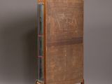 an image of a tall wooden cabinet with a drawer on one side and a drawer on the other side