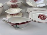 many different types of dishes and bowls on the table