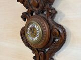 a clock hanging on the wall of a room