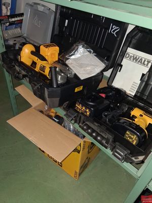 many tools that are sitting on a shelf in the room
