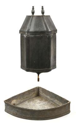 a metal container with a lid on a white surface