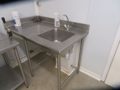 a stainless steel sink and a stainless steel counter