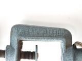 a close up of a pipe clamp on a white background
