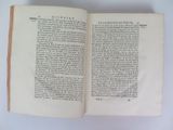 an open book on a table with a white background
