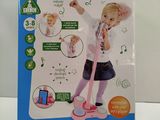 a box with a picture of a little girl singing on a microphone