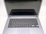 a silver laptop with a black keyboard on a table