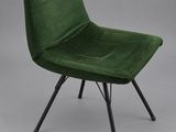 a green chair with black legs on a grey background