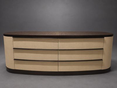 an oval coffee table with three drawers and a wooden top