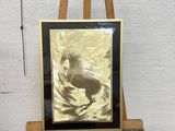 a picture of a picture of a horse on a easel