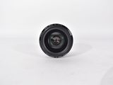 an image of a camera lens sitting on top of a white surface