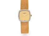 une montre-bracelet en or 18 carats sertie de diamants, signée Cartier