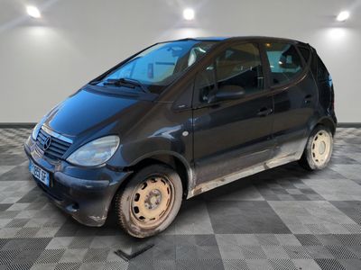 an image of a small black car in a garage