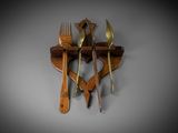 a wooden spoon, fork and knife holder on the wall