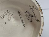 a close up of a cup with writing on it