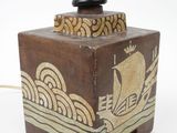 a small wooden box with a lamp on top of it