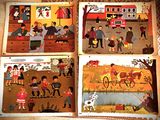 Quatre puzzles pour enfants d'âges différents sont posés sur une table.