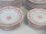 a lot of plates and cups on the table
