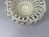 a white bowl sitting on top of a white table