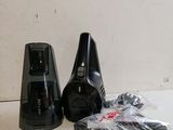 two black speakers sitting on a table next to each other