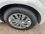 a close up of a tire on a white car