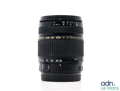 a black camera lens sitting on a white surface