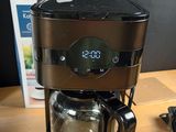 a coffee maker that is sitting on a table