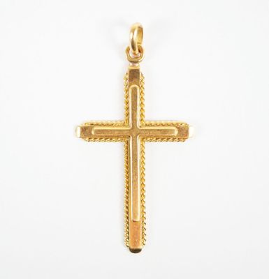 a gold cross pendant on a white background