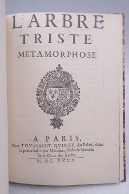 a book with a picture of a coat of arms on it