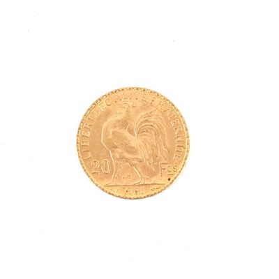 une pièce d'or sur laquelle est représenté un coq